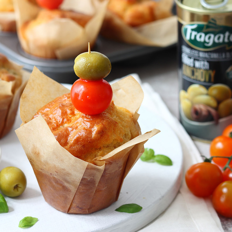 Savoury Olive Muffins Savoury muffins with cherry tomatoes and mozzarella. With a side dish of olives.