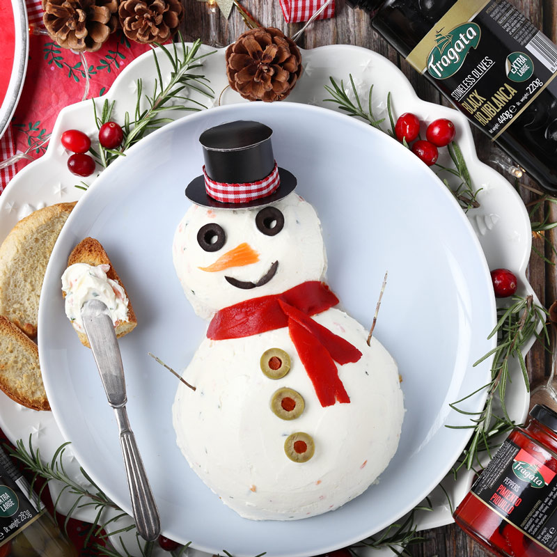 Salmon mousse shaped like a snowman Salmon mousse shaped like a snowman